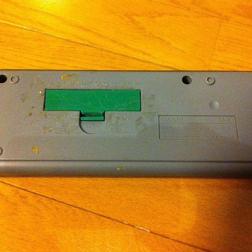 8377963925_70d1a5626e_k.jpg Battery cover for Casio mini keyboard