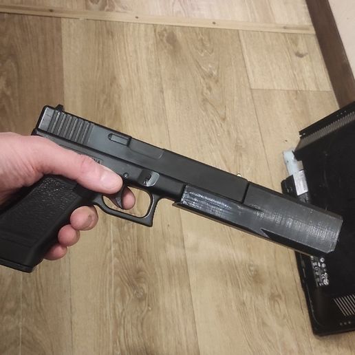 b8572e3c-d72f-49ba-ac8b-6152fdb9c085.jpg Glock_18c_cm030_Supperessor