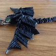 Imagen-de-WhatsApp-2023-12-14-a-las-14.49.31_86d9c749.jpg FLEXI PACK - TOOHLESS AND LIGHT FURY KEYCHAINS // HOW TO TRAIN YOUR DRAGON