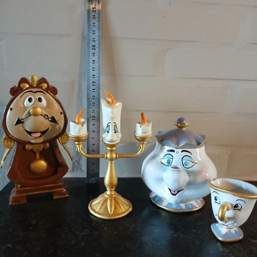 the clock,the chandelier,the teapot and its cup from beauty and the beast