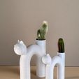 IMG_0105.jpg Minimalist-designed cat-shaped planter