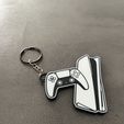 Image-2026-06-16T035953.688.jpg PlayStation-inspired keychain