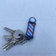 IMG_5767.jpeg barber pole keychain