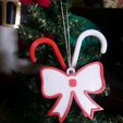 50283d29-950b-4bea-bdee-d1b16ecc7f33.jpg Christmas bows with canes