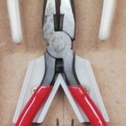 Pliers_and_Cutters.jpeg Wall holder for various types of small pliers and side cutters